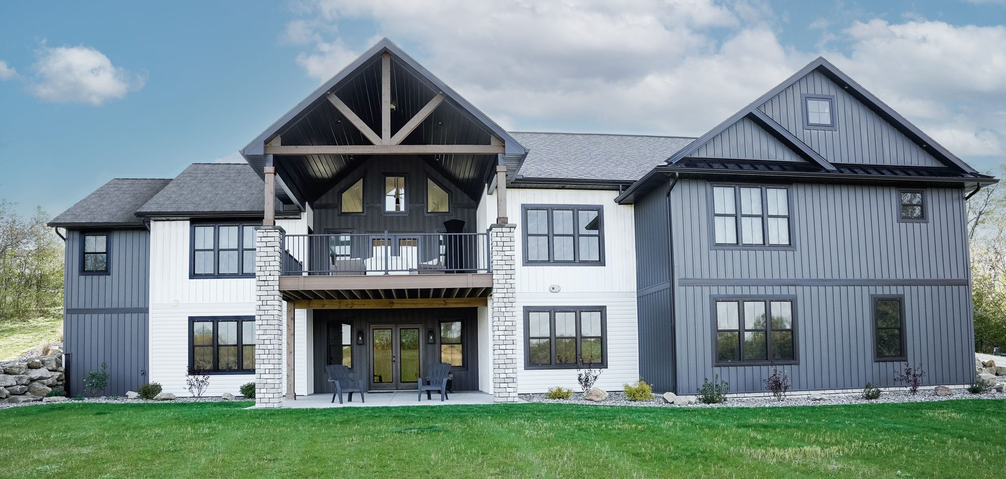A large house with two levels and a balcony.