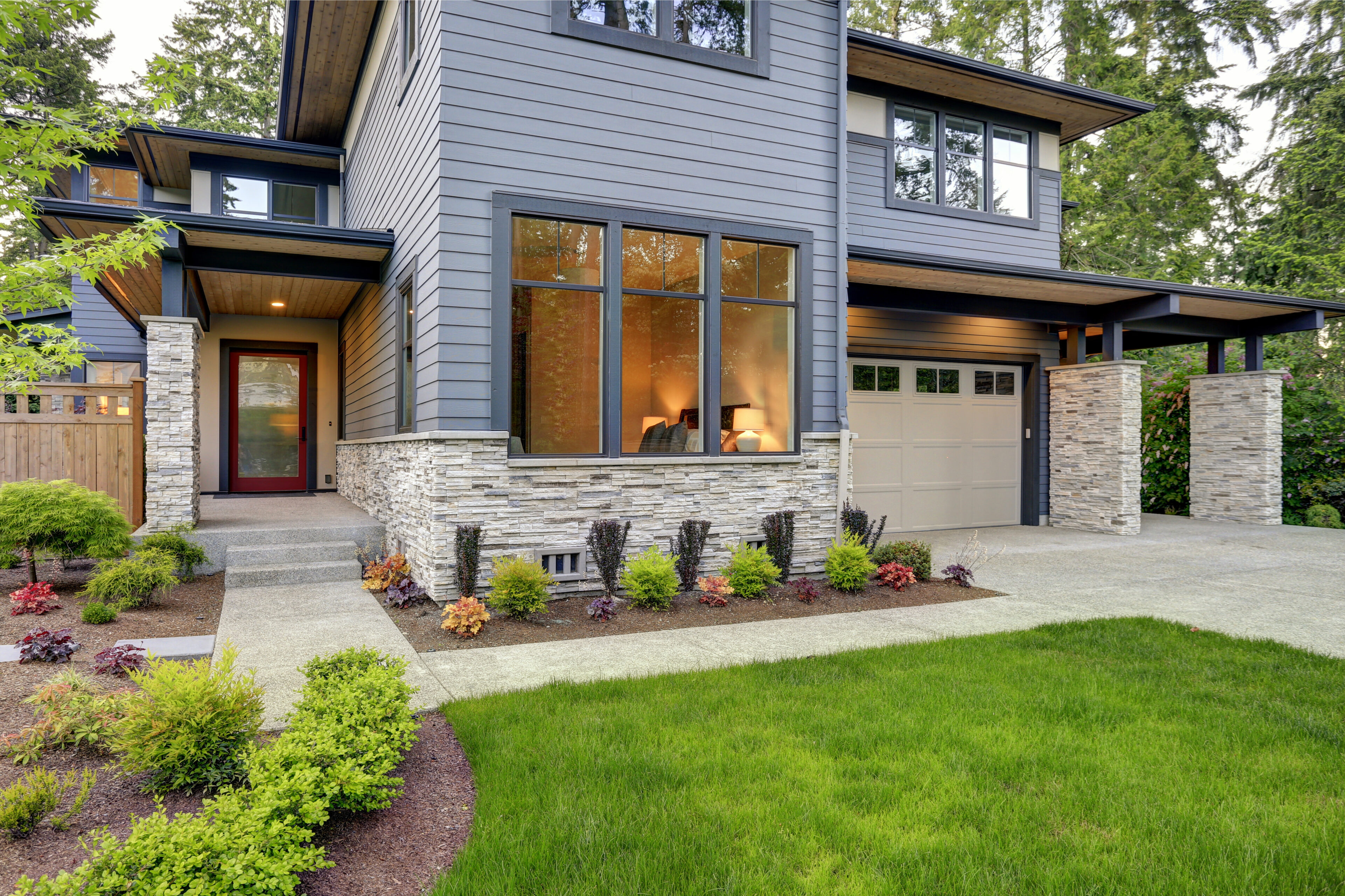 Modern house with landscaped front yard.